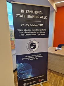 A sign for the conference saying 'International Staff Training Week'